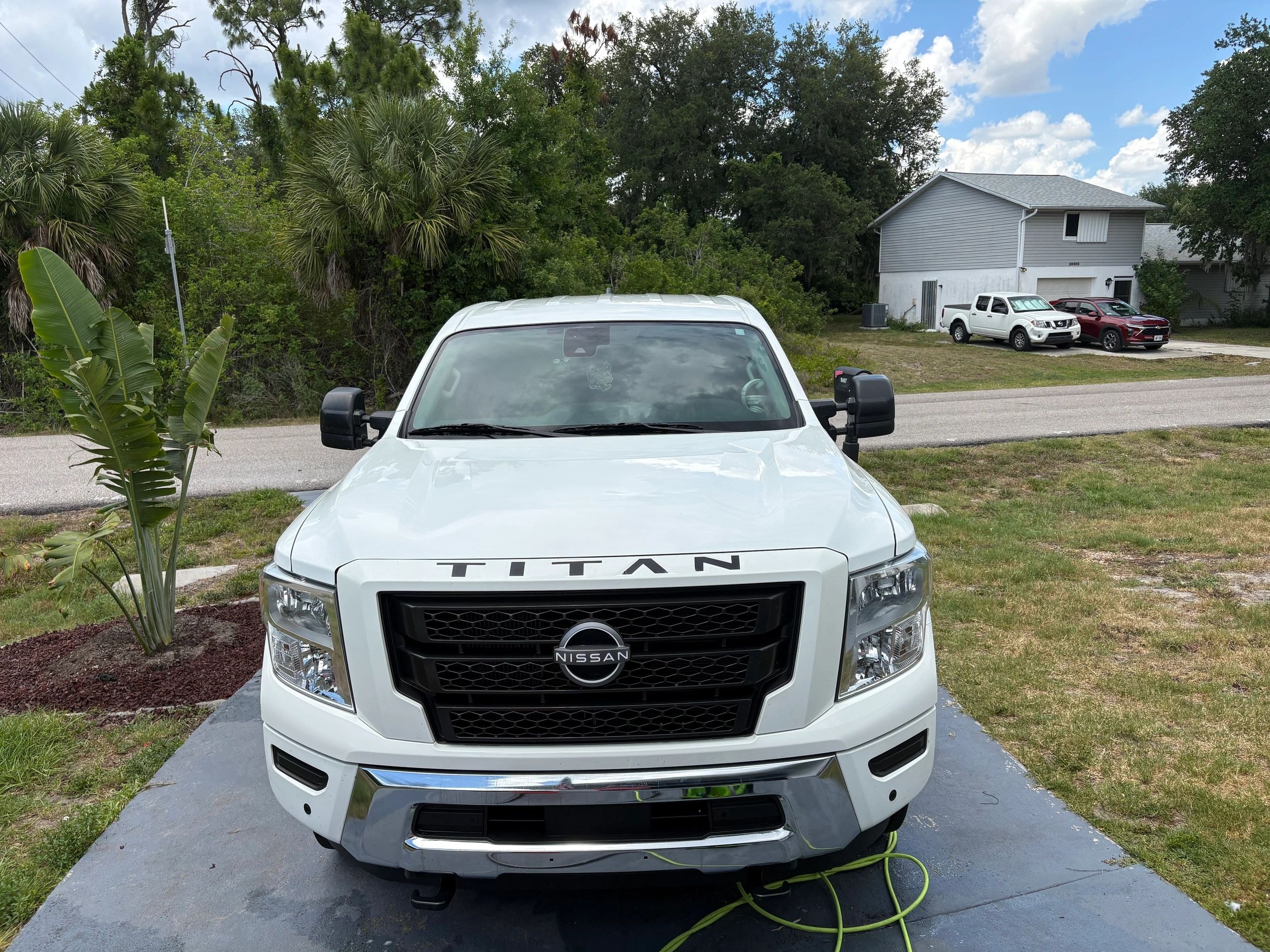 White Nissan Titan pickup truck after detailing