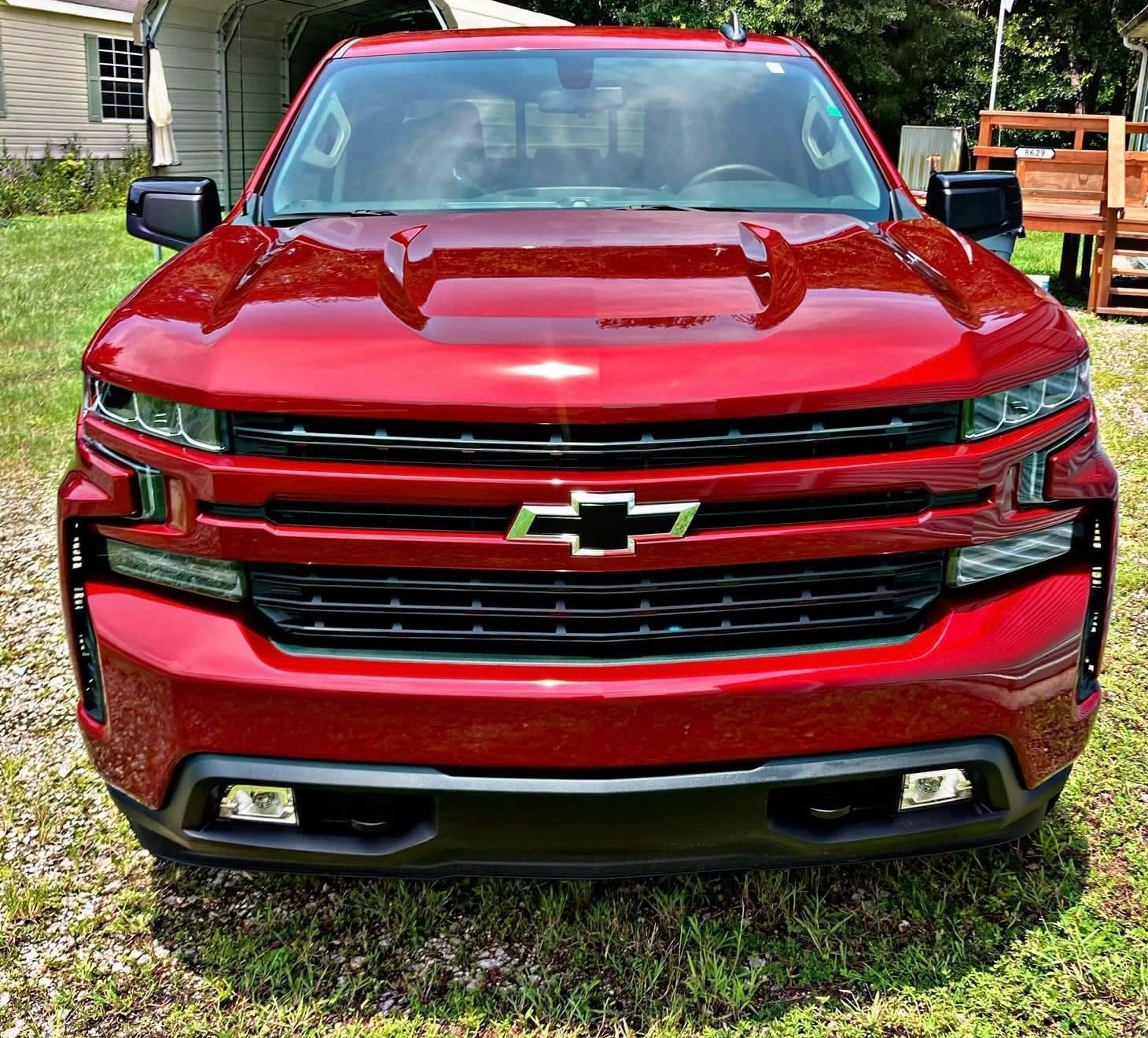 Red Chevrolet pickup truck after ceramic coating