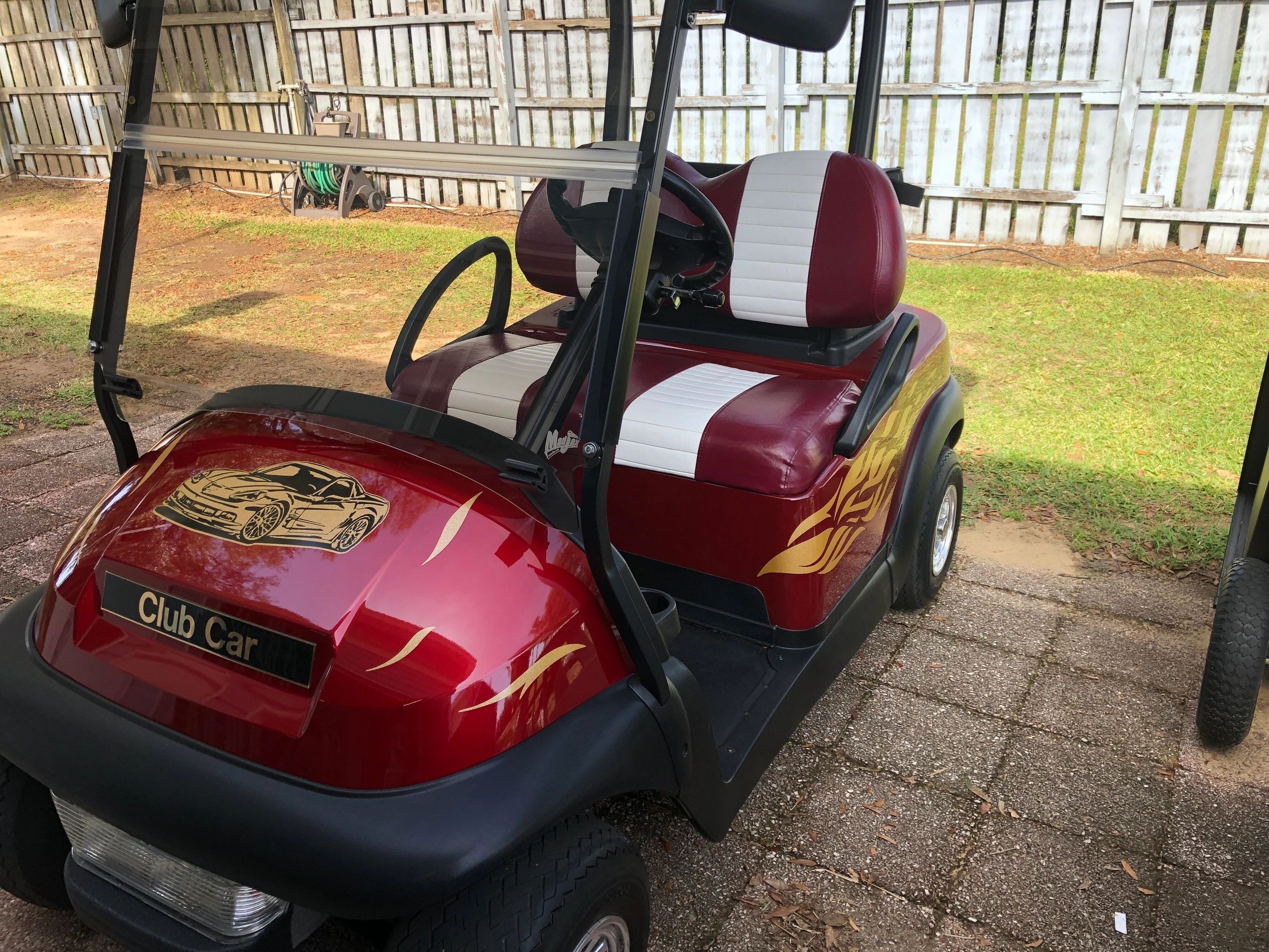 Red and gold custom golf cart after ceramic coating